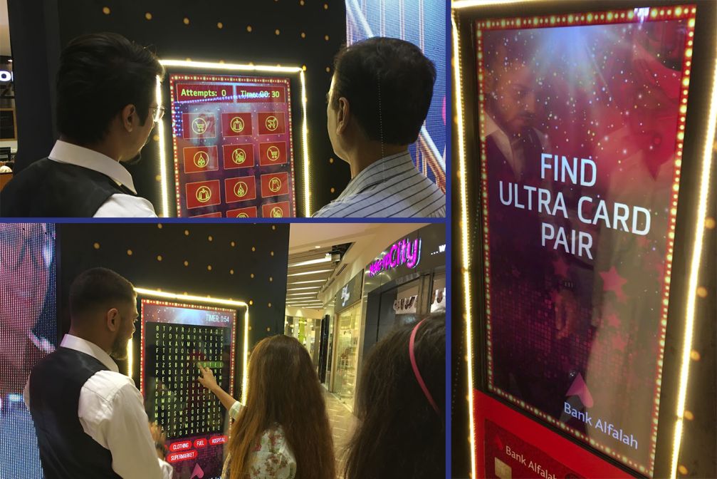 Digital engagement setup showcasing interactive touchscreen games and gamified experiences designed for Bank Alfalah card activation at a high-footfall event